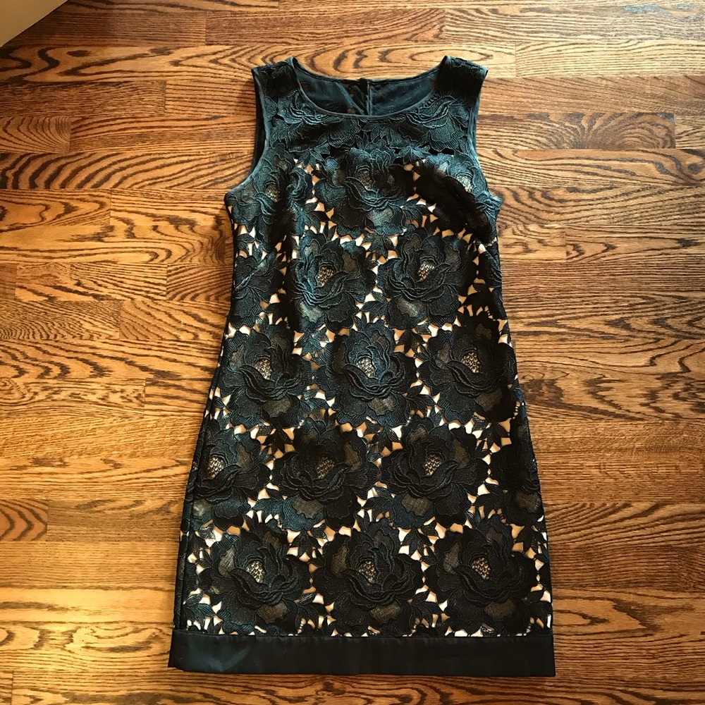 White House Black Market black overlay with nude lining size 4